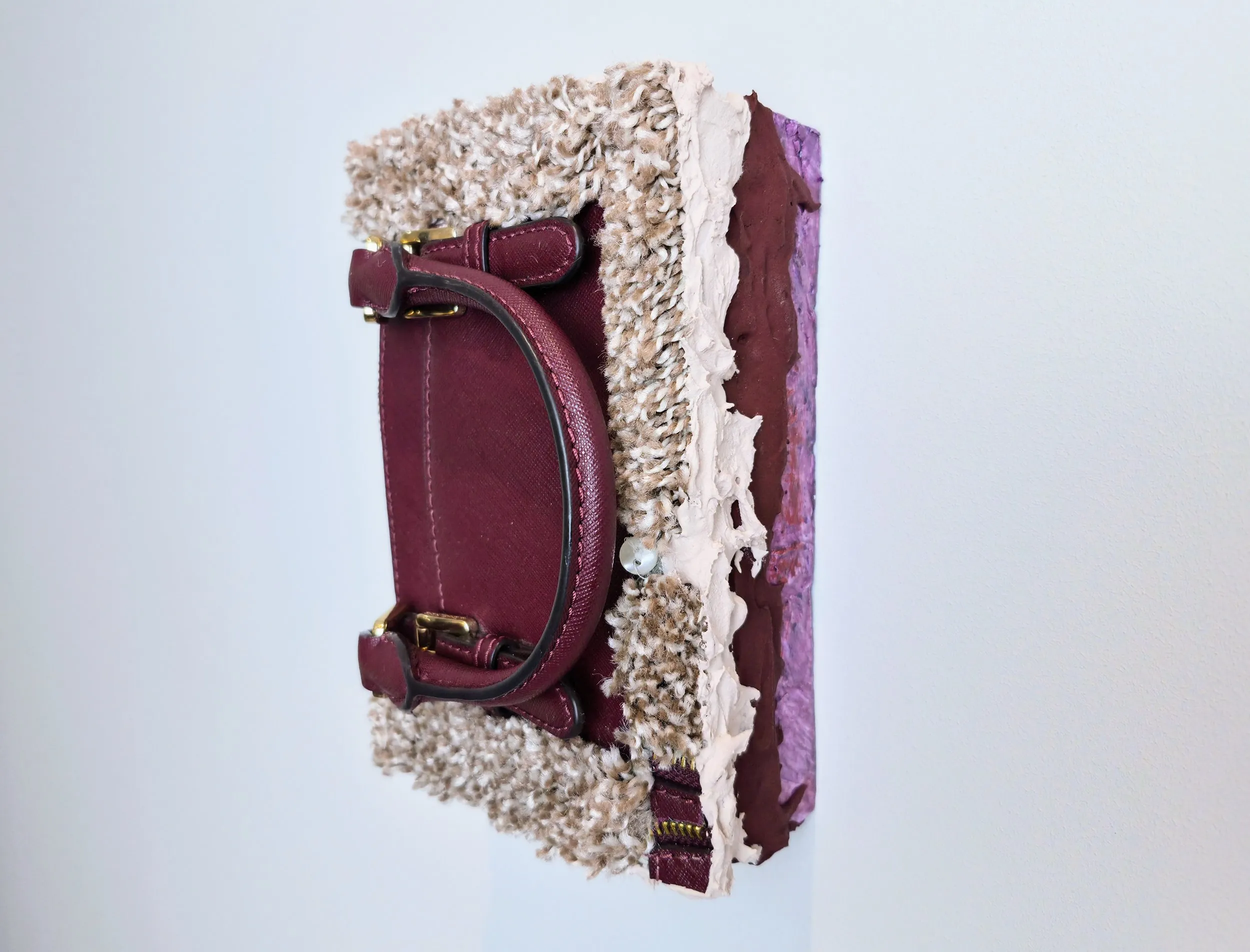 Baggage, clay, acrylic, found fabrics, modelling paste and mixed media